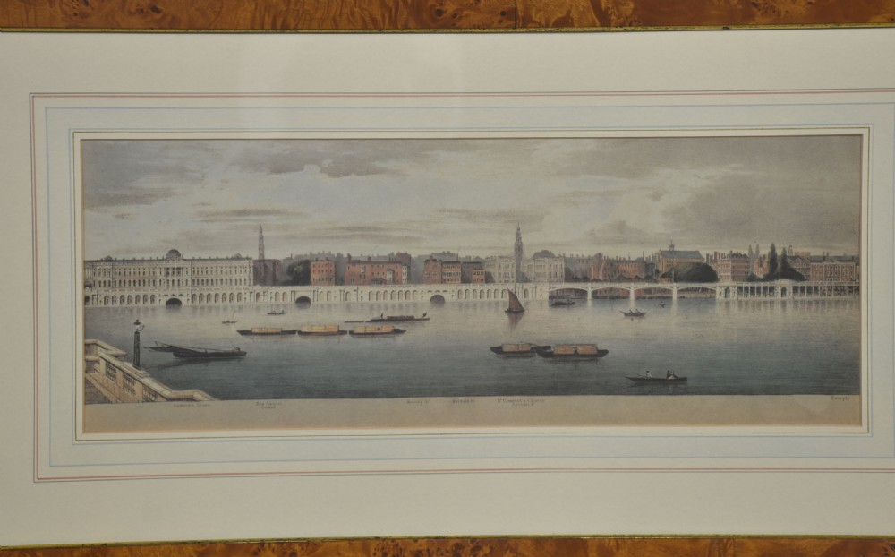 A set of six matching framed rectangular prints displaying panoramic views of the River Thames set within rich burr walnut frames with light cream mounts. View XIV