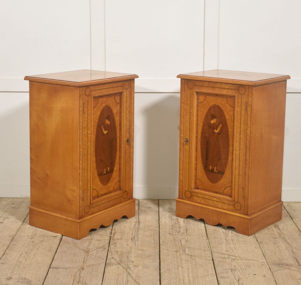 A pair of golden satinwood Neo-Classical Revival bedside cabinets featuring oval marquetry panels depicting classical figures playing instruments. View VI