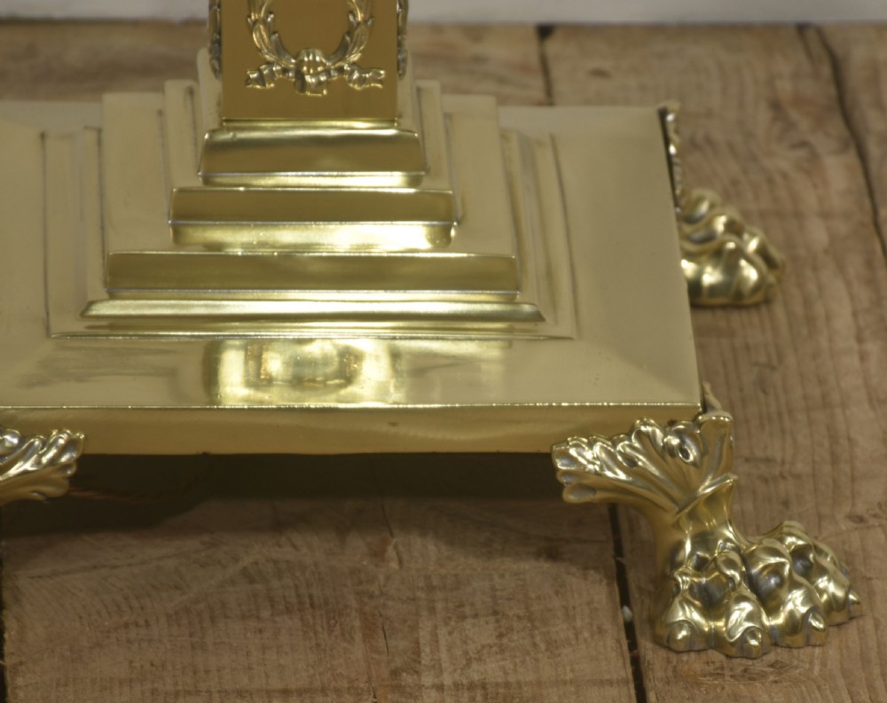 A Neoclassical standard lamp with a black central column, brass Corinthian capital, stepped square claw-foot base, and a scalloped cream fringed shade. View VII