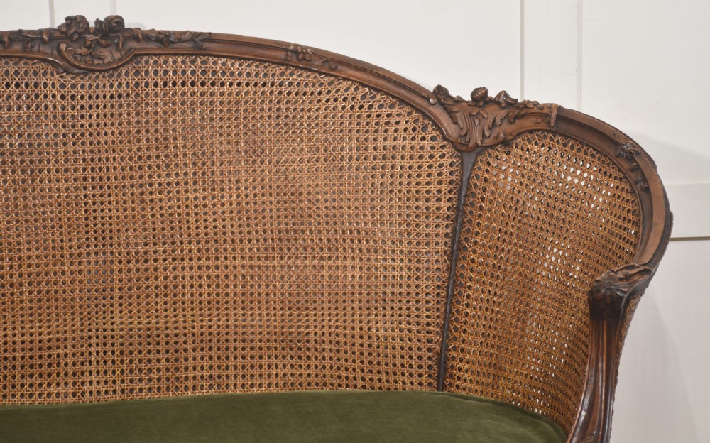  Louis XV–Style Carved Walnut Caned Settee View II