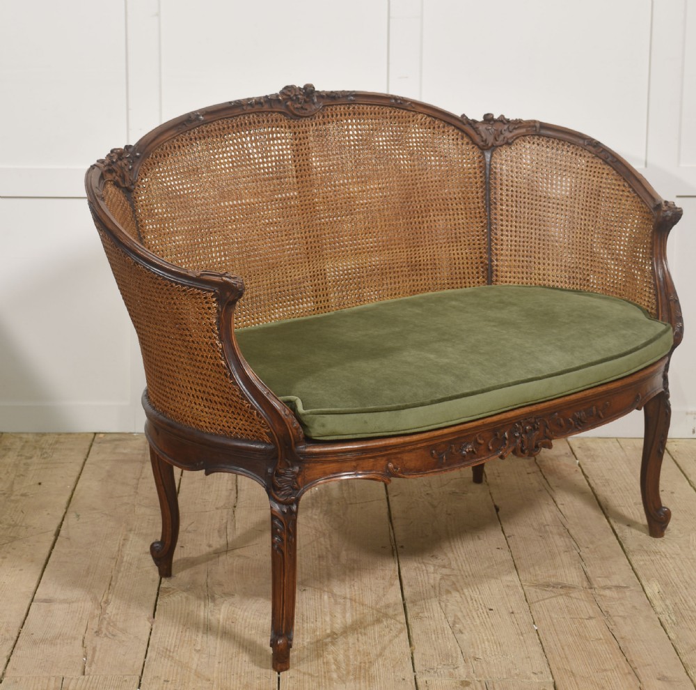  Louis XV–Style Carved Walnut Caned Settee View VI