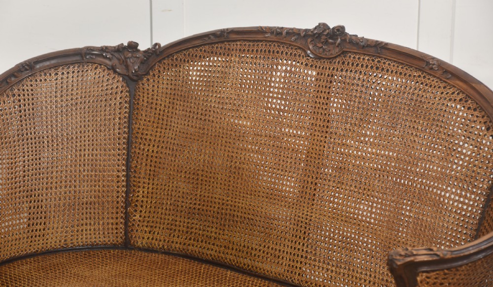  Louis XV–Style Carved Walnut Caned Settee View X