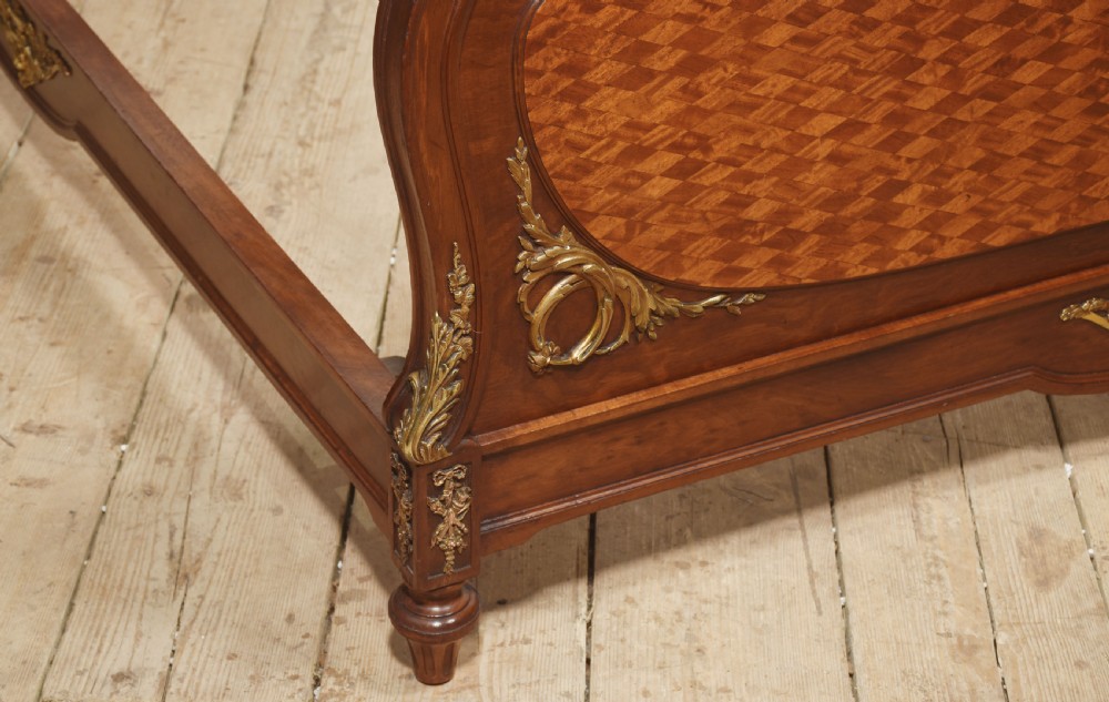 A Louis XVI style mahogany double bed frame featuring decorative parquetry veneer panels and polished gilt bronze mounts. View XII