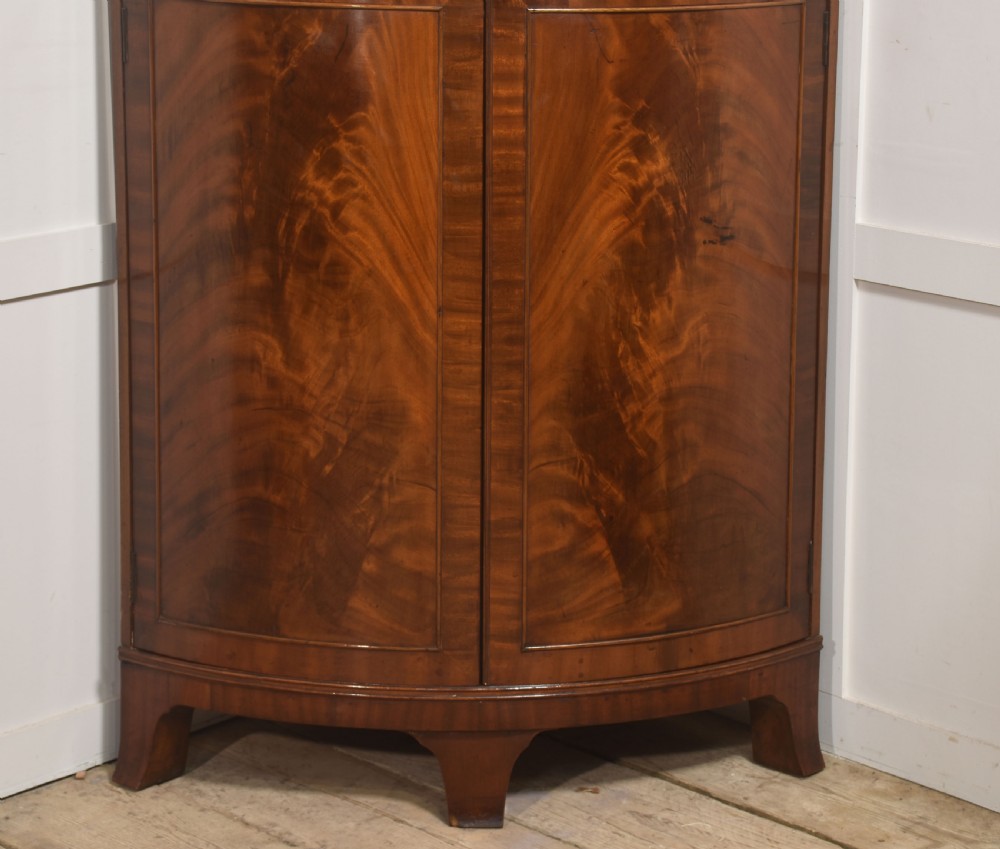 Early 20th Century Figured Mahogany Bowfront Corner Wardrobe View IV
