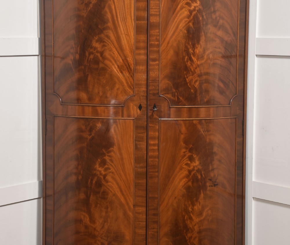 Early 20th Century Figured Mahogany Bowfront Corner Wardrobe View V