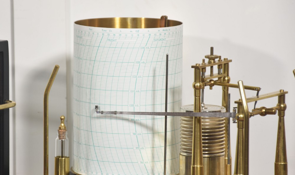 An antique Short and Mason aneroid barograph housed in a black glazed wooden case with brass carrying handles and internal mechanism. View IV