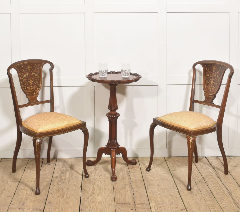A pair of Edwardian inlaid mahogany side chairs with vase-shaped marquetry splats, cabriole front legs, and golden upholstered seats. View II
