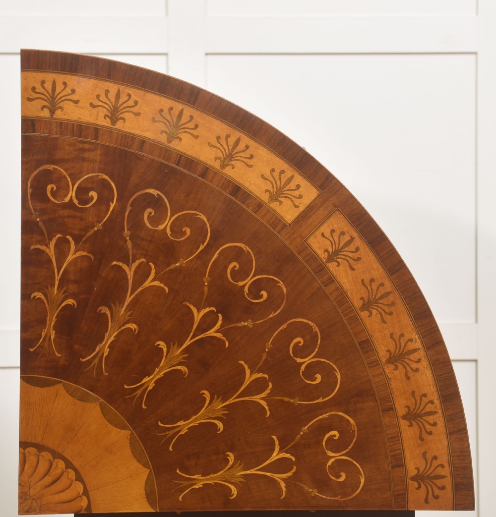 A floor-standing Sheraton Revival bow-front mahogany corner cabinet with satinwood neoclassical urn marquetry on twin doors. View VII