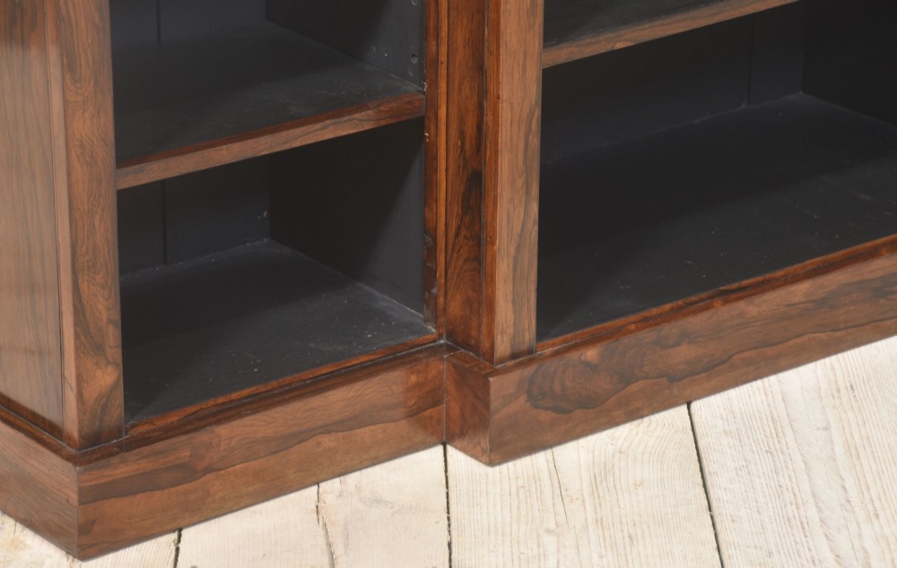 A large Victorian rosewood breakfront open bookcase featuring three shelf sections, carved barley twist columns, and a spindle gallery along the top edge. View II