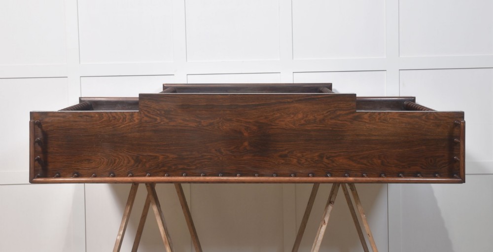 A large Victorian rosewood breakfront open bookcase featuring three shelf sections, carved barley twist columns, and a spindle gallery along the top edge. View VI