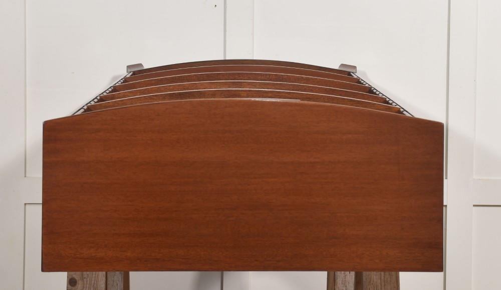 A tall, narrow mahogany open bookcase featuring five shelves, decorative inlay on the top frieze, and shaped bracket feet. View XII