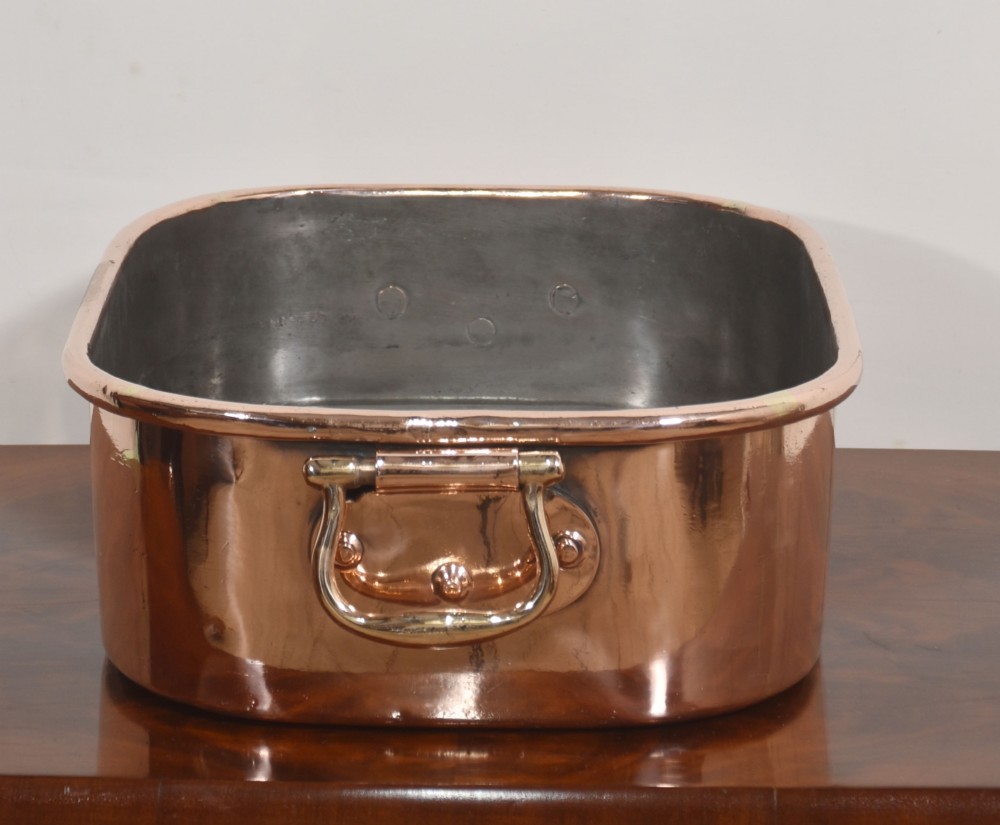 A deep rectangular antique copper fish kettle featuring heavy riveted brass drop handles and a tin-lined interior. View V