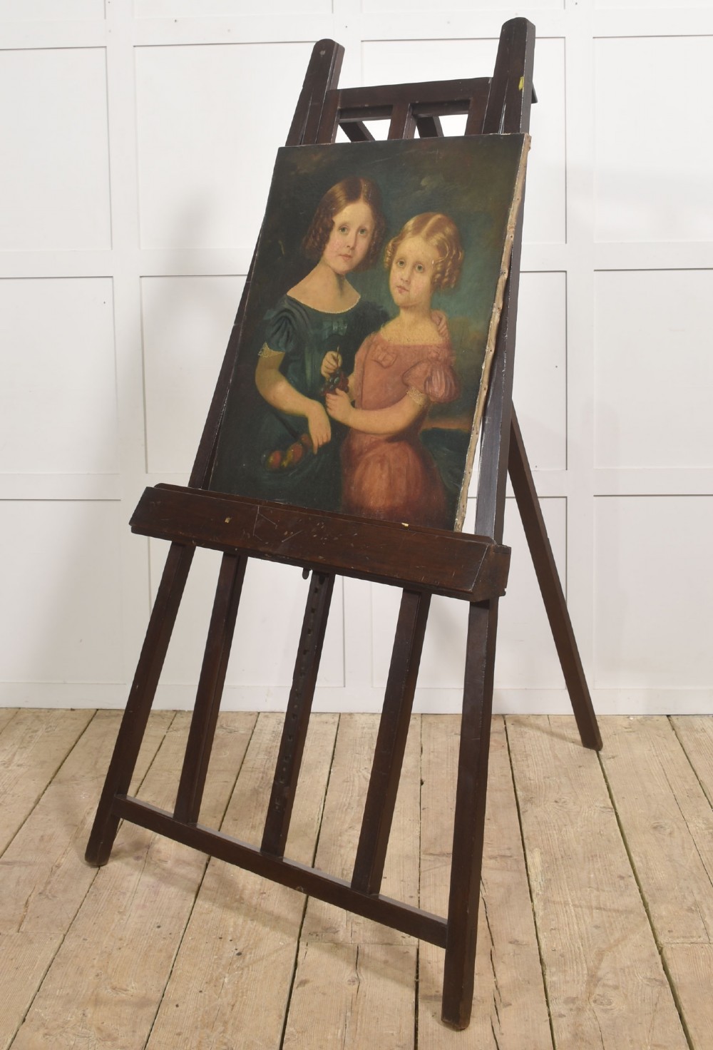 A large 19th-century mahogany floor-standing studio easel with a central adjustable shelf and an A-frame structure. View II