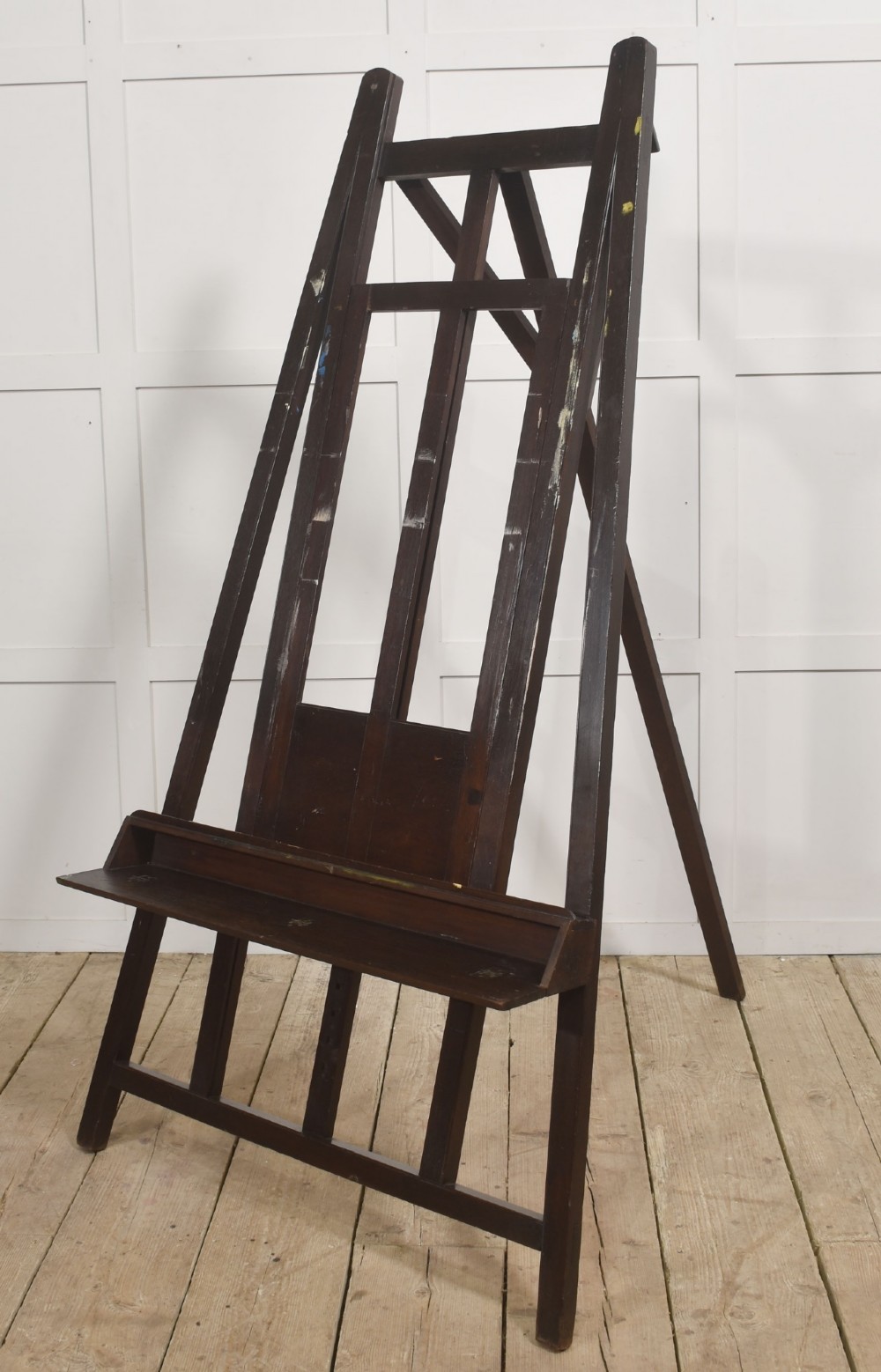 A large 19th-century mahogany floor-standing studio easel with a central adjustable shelf and an A-frame structure. View VIII