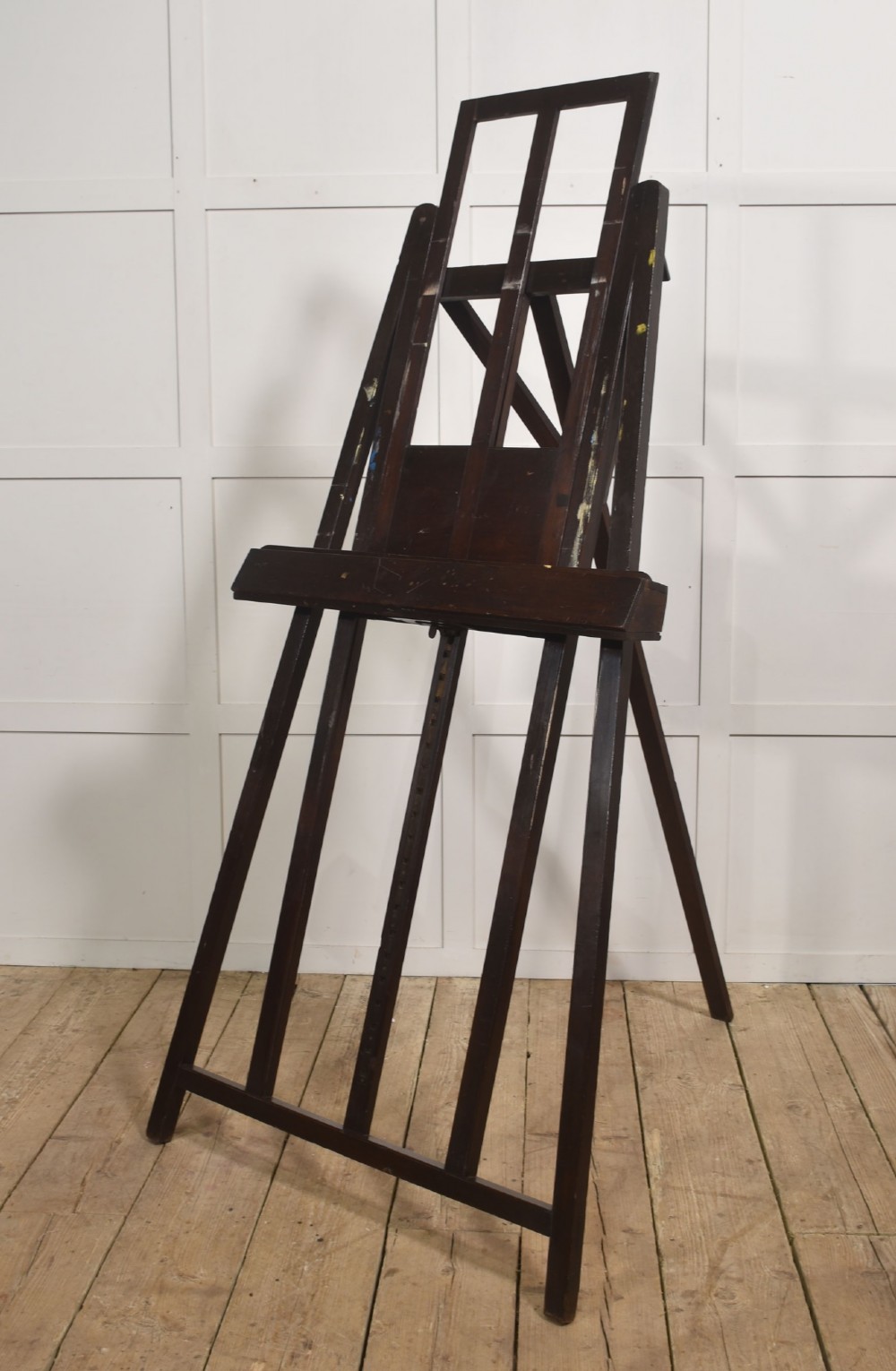 A large 19th-century mahogany floor-standing studio easel with a central adjustable shelf and an A-frame structure. View IX
