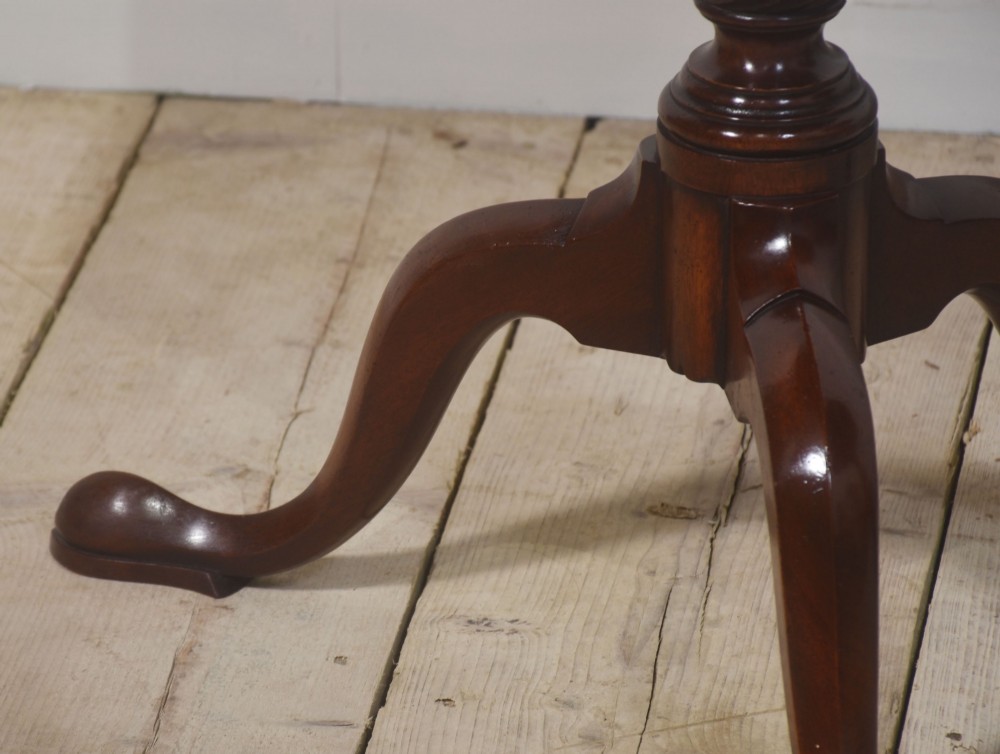 A matching pair of octagonal mahogany tripod tables featuring central starburst marquetry inlays, spiral twist turned columns, and three cabriole legs. View XI
