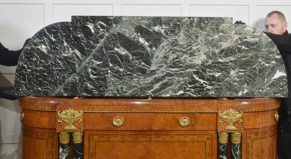 A French bow-front buffet sideboard featuring a dark marble top, burr walnut marquetry, central figural medallions, and flanking marble columns with gilt mounts. View XV