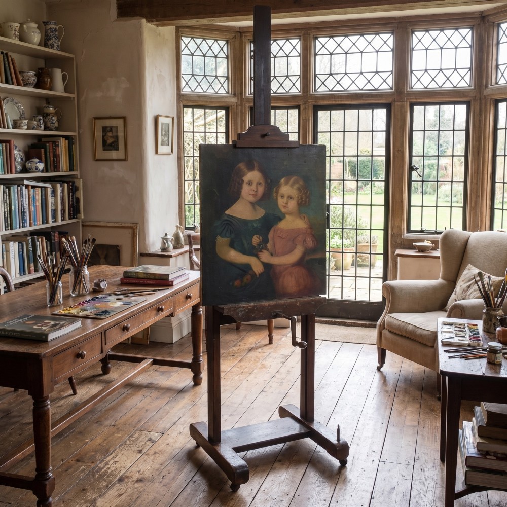 A nineteenth-century dark oak artist studio easel featuring a winding crank handle mechanism and castors on the base. View II