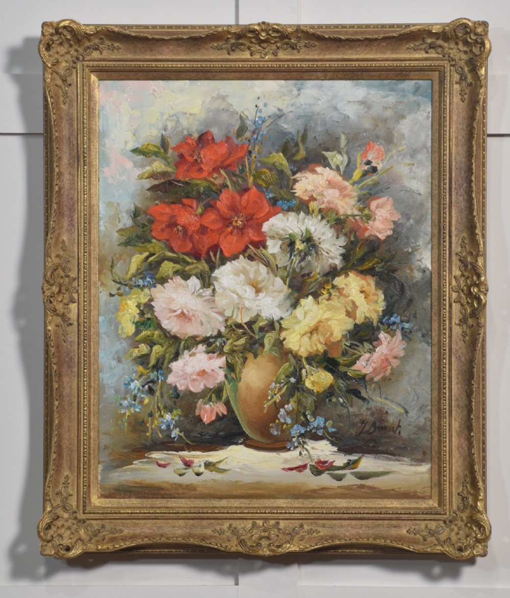 A pair of framed oil paintings depicting colourful arrangements of flowers in ceramic vases set within ornate gilded frames. View III