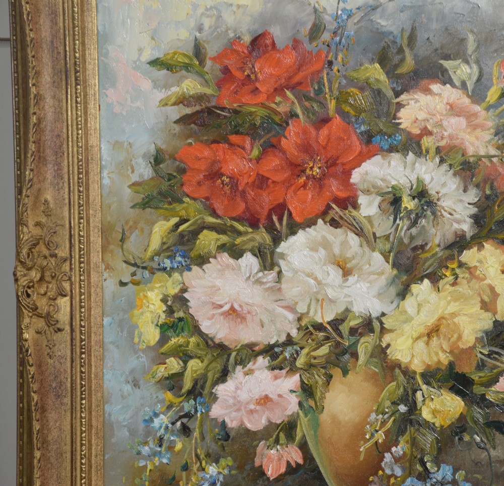 A pair of framed oil paintings depicting colourful arrangements of flowers in ceramic vases set within ornate gilded frames. View VIII