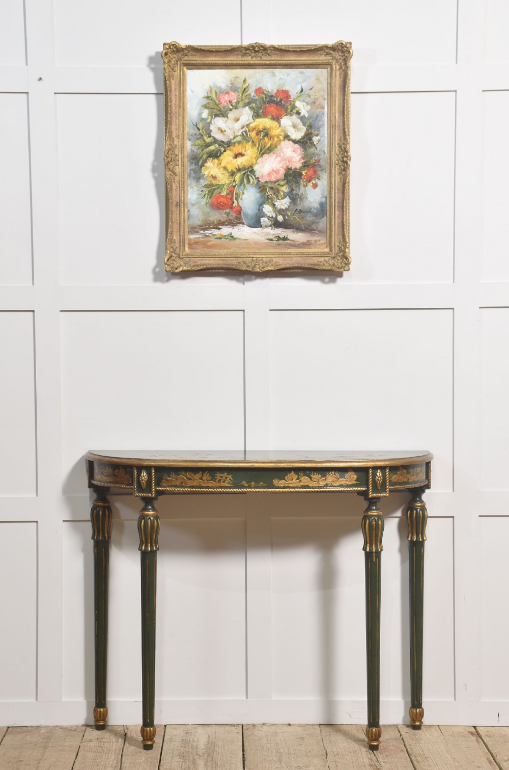 A dark green demi-lune console table with hand-painted gold chinoiserie decoration along the frieze and fluted tapered legs. View III