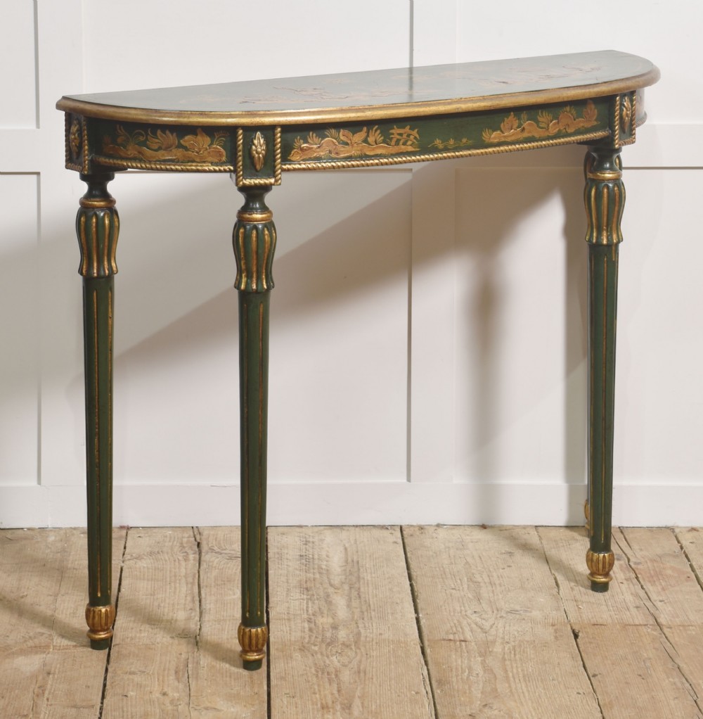 A dark green demi-lune console table with hand-painted gold chinoiserie decoration along the frieze and fluted tapered legs. View IV