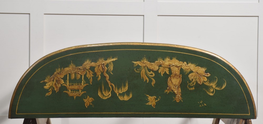 A dark green demi-lune console table with hand-painted gold chinoiserie decoration along the frieze and fluted tapered legs. View VIII