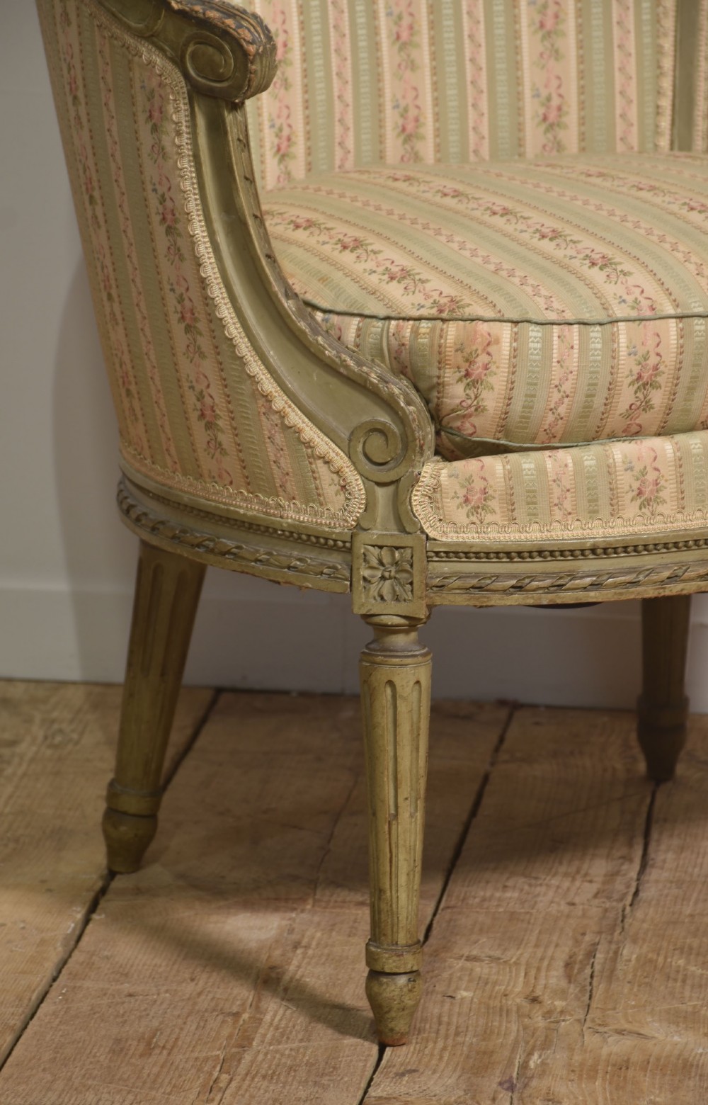 A pair of grey-painted French tub armchairs upholstered in a striped floral pastel fabric with fluted legs. View IV