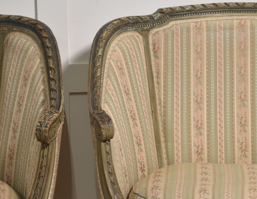 A pair of grey-painted French tub armchairs upholstered in a striped floral pastel fabric with fluted legs. View VII