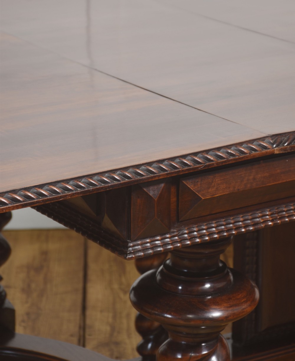 A large 19th-century Portuguese rosewood extending dining table with carved barley-twist legs, an H-stretcher base, and two removable extension leaves standing behind it. View VIII