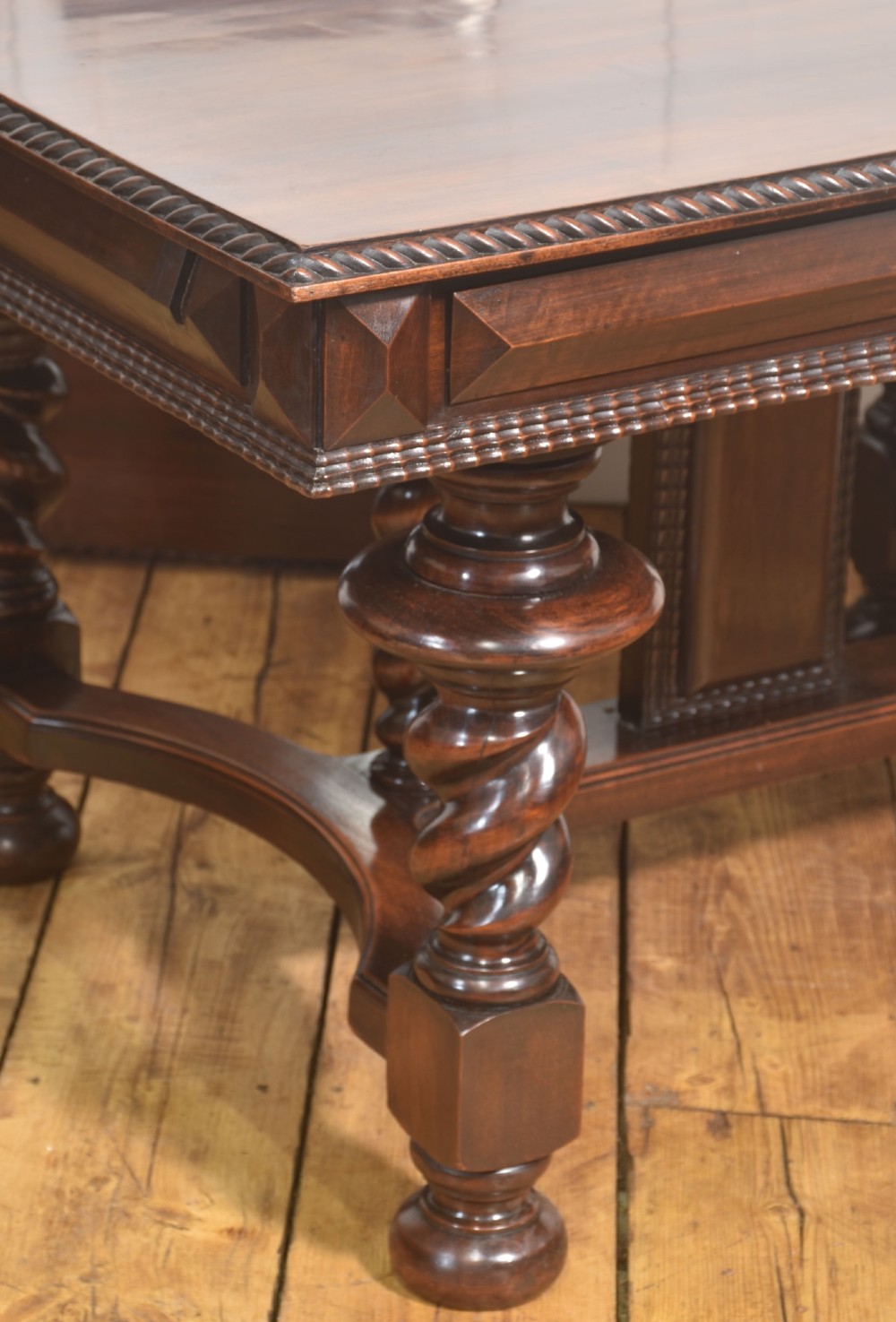 A large 19th-century Portuguese rosewood extending dining table with carved barley-twist legs, an H-stretcher base, and two removable extension leaves standing behind it. View XI