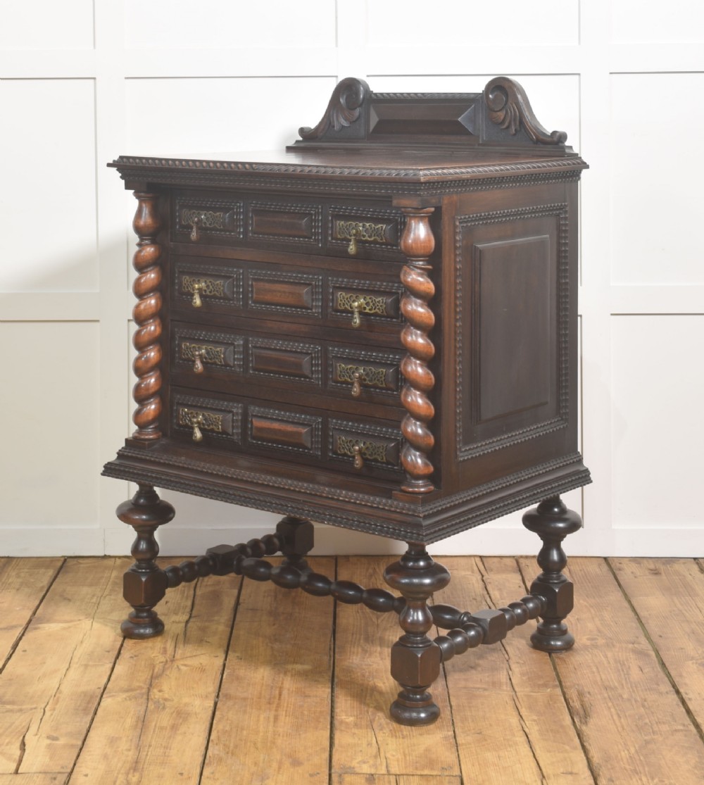 A 19th-century dark rosewood chest on stand with four drawers, pierced brass drop handles, barley twist side columns, and turned legs. View VII