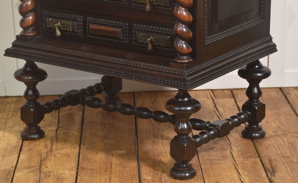 A 19th-century dark rosewood chest on stand with four drawers, pierced brass drop handles, barley twist side columns, and turned legs. View VIII