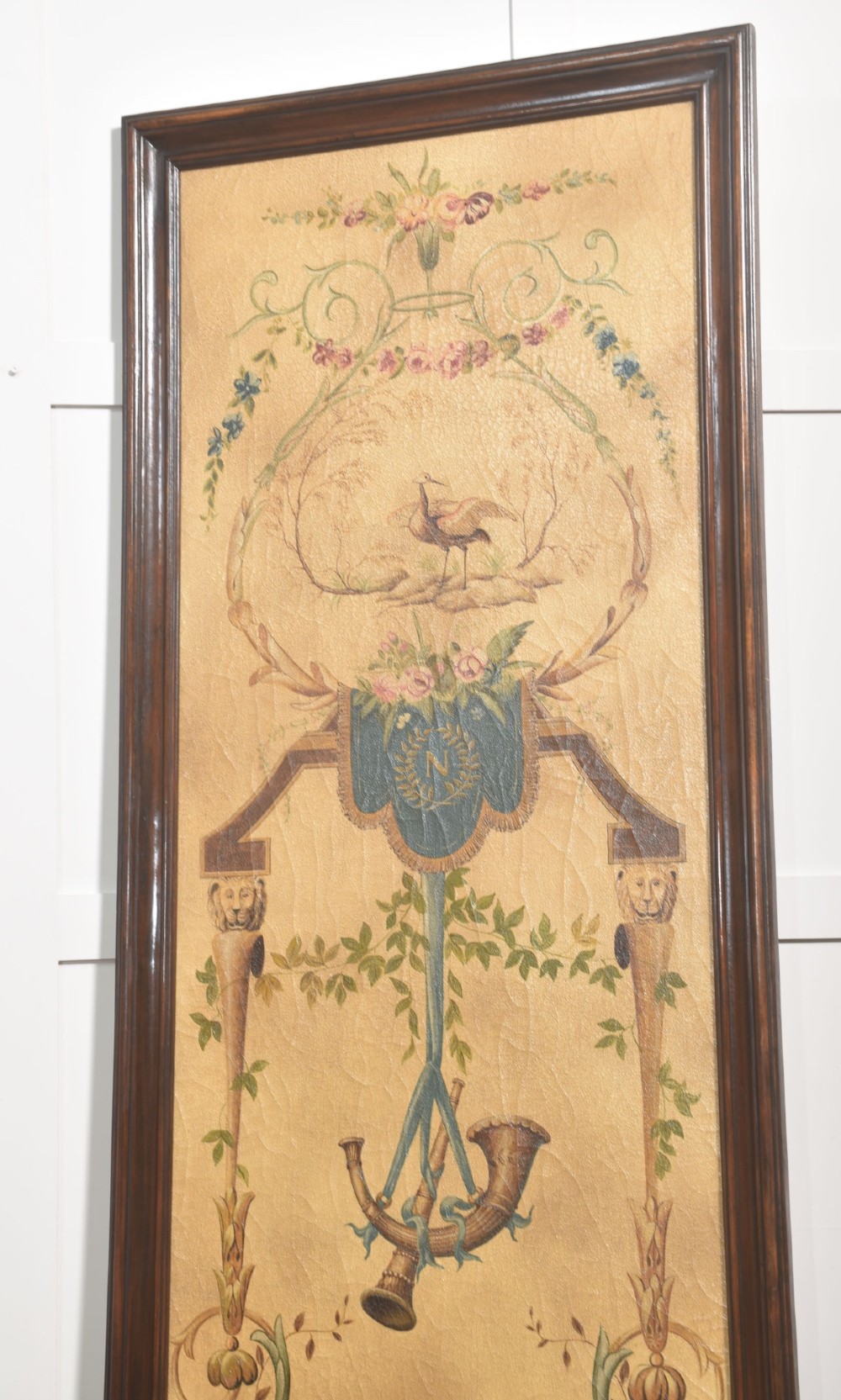 A pair of tall rectangular dark wood framed panels featuring hand-painted Neoclassical motifs, lyres, floral swags, and Napoleonic heraldry on a gold ground. View VI