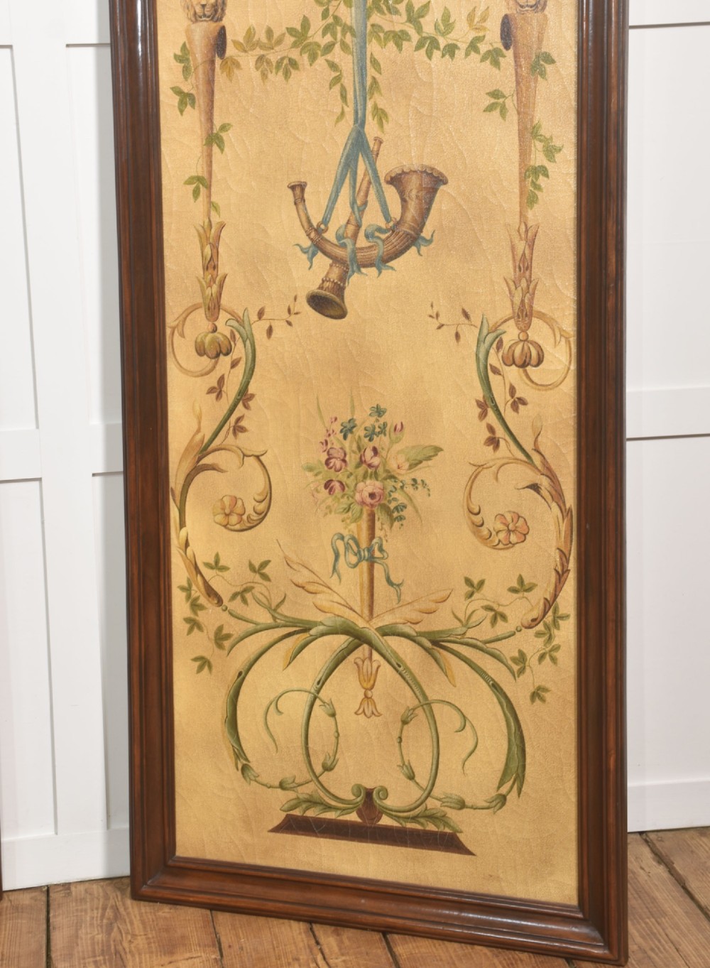 A pair of tall rectangular dark wood framed panels featuring hand-painted Neoclassical motifs, lyres, floral swags, and Napoleonic heraldry on a gold ground. View VII