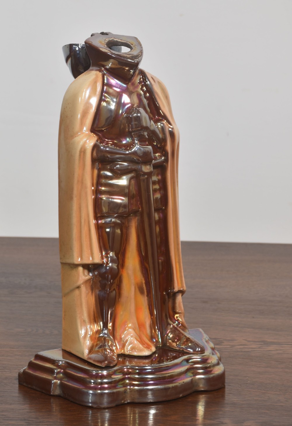 A metallic knight in full armour fireside companion stand holding a shovel and tongs, with a matching brush resting beside it. View VIII