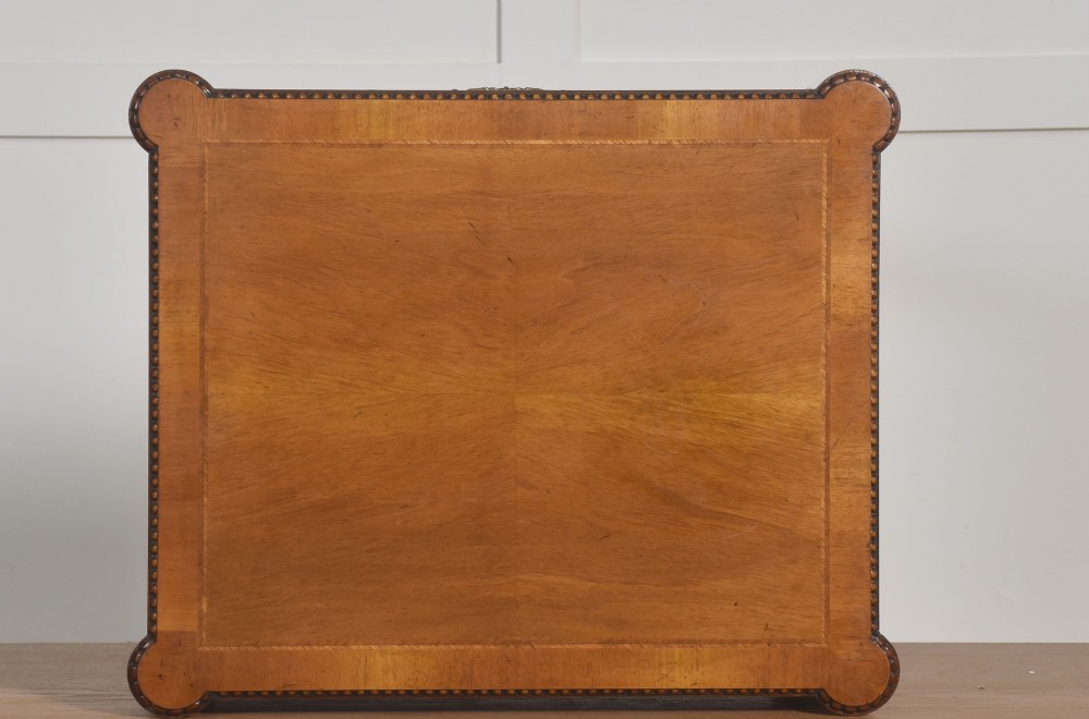 A pair of Edwardian walnut side tables featuring single drawers with brass handles and fluted turned legs. View XI