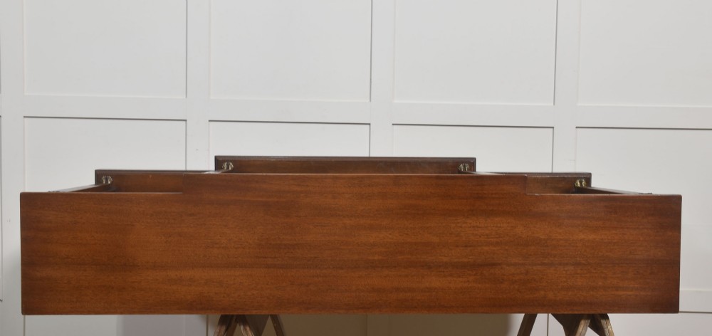 A low Regency style mahogany breakfront open bookcase featuring fluted pilasters, brass mounts, and adjustable shelves. View VIII
