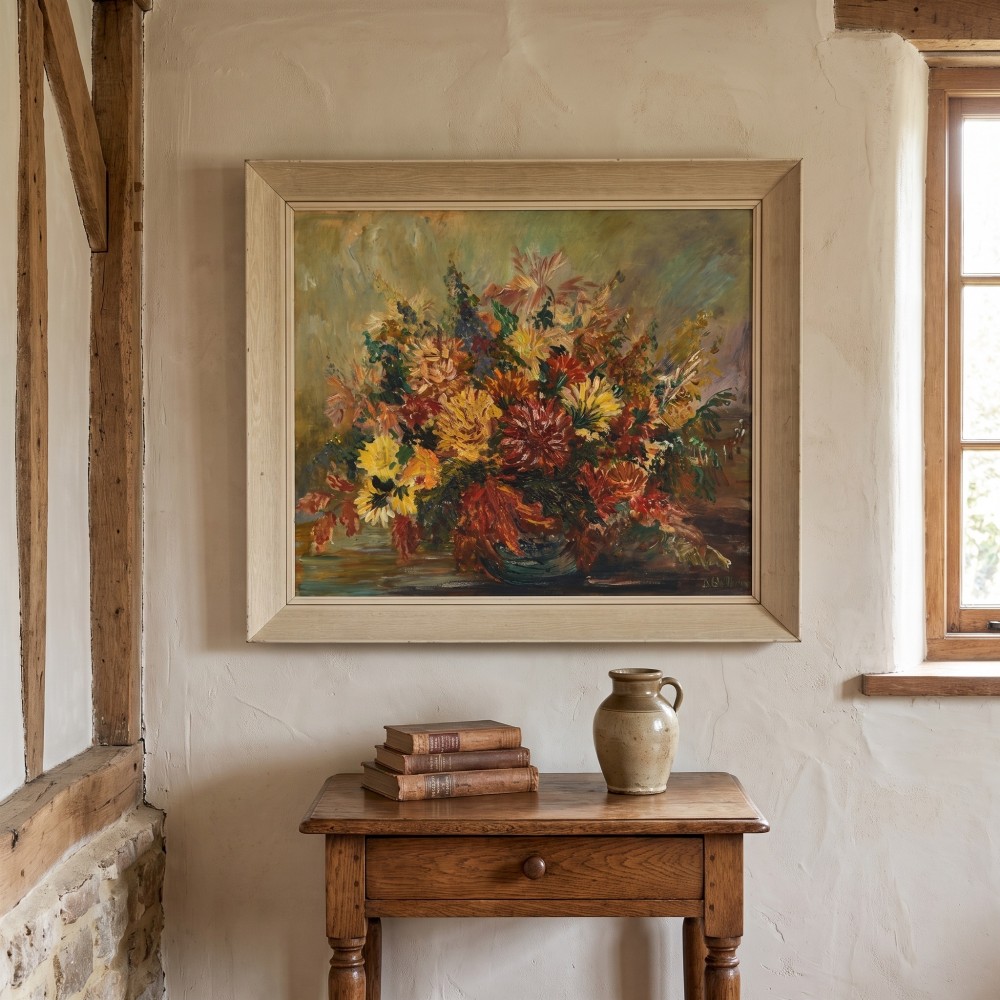 An oil painting depicting a dense arrangement of yellow, red, and orange flowers in a bowl, set within a light cream wooden frame. View II
