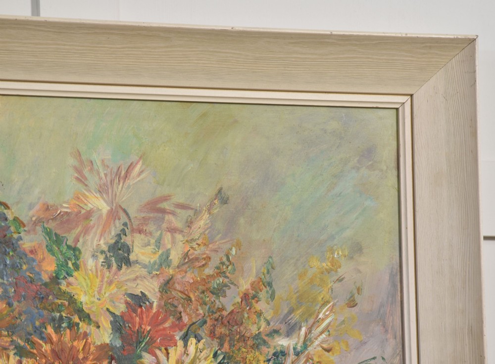 An oil painting depicting a dense arrangement of yellow, red, and orange flowers in a bowl, set within a light cream wooden frame. View VI