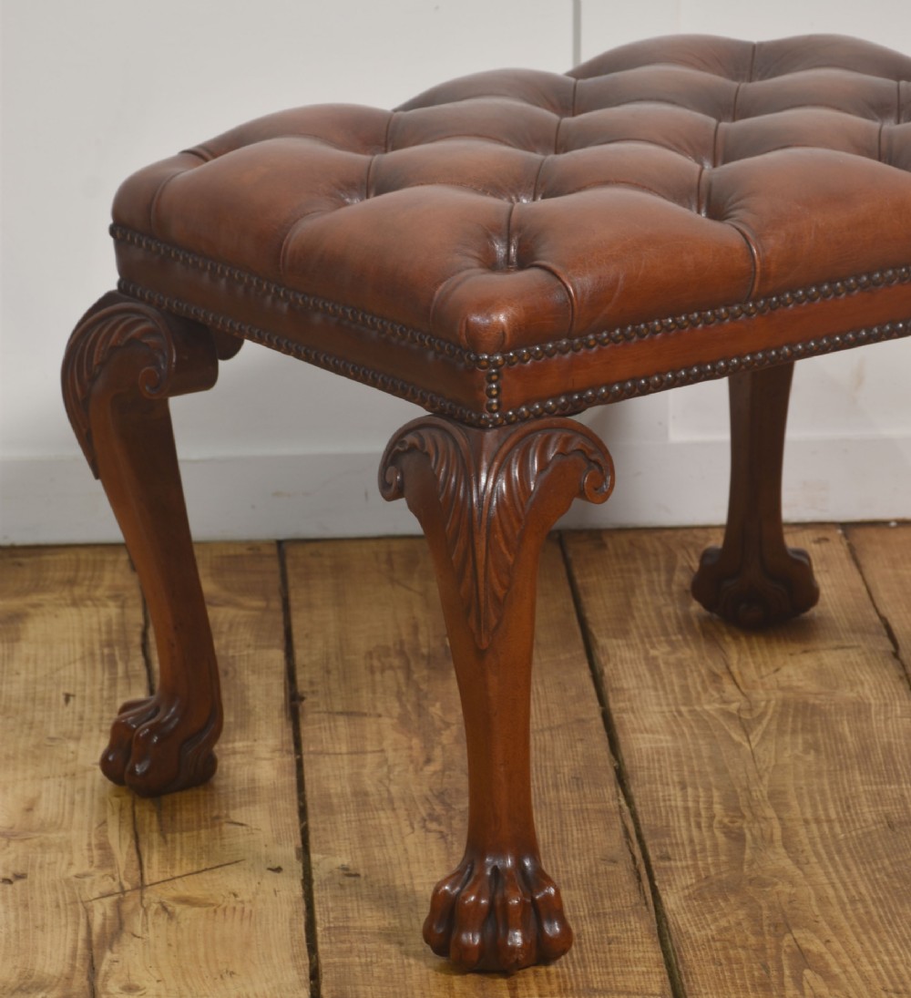 A deep-buttoned brown leather stool featuring brass stud detailing and carved mahogany cabriole legs ending in ball-and-claw feet. View III