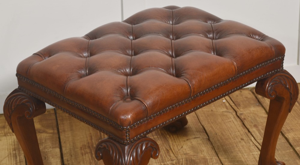 A deep-buttoned brown leather stool featuring brass stud detailing and carved mahogany cabriole legs ending in ball-and-claw feet. View IV