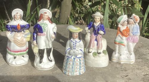 fig 1. A collection of fifteen miniature hand-painted Victorian Staffordshire earthenware figurines depicting various folk characters.