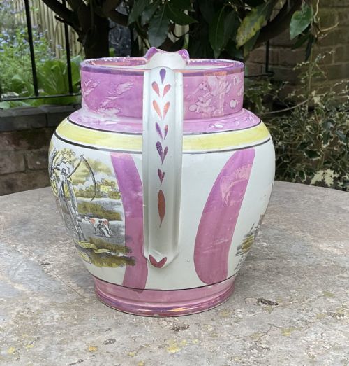 fig 1. A Georgian Sunderland pink splash lustre pottery jug decorated with a transfer-printed tall ship, verse inscription, and yellow accents.