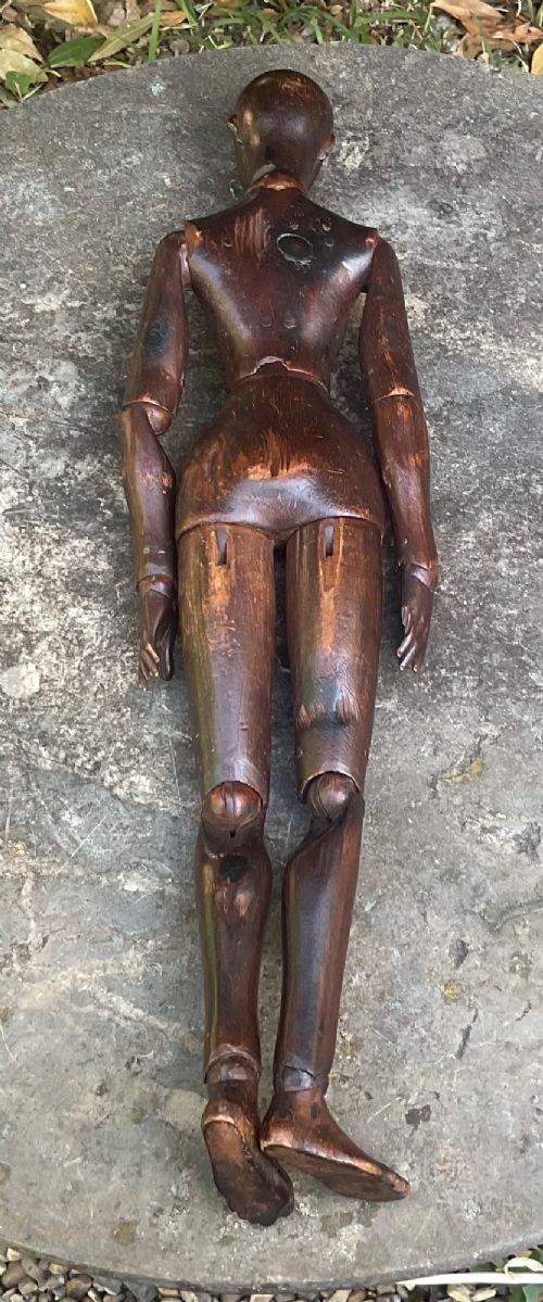fig 1. A nineteenth-century articulated carved dark wood artists lay figure seated with crossed legs and posed arms.
