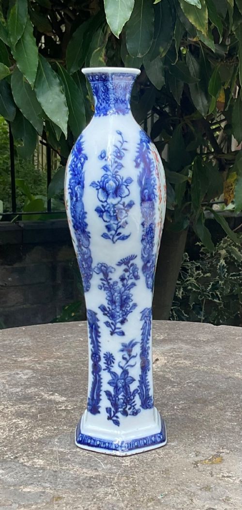An 18th-century Chinese porcelain vase featuring cobalt blue framed panels enclosing hand-painted pink and orange enamel floral cartouches. View II