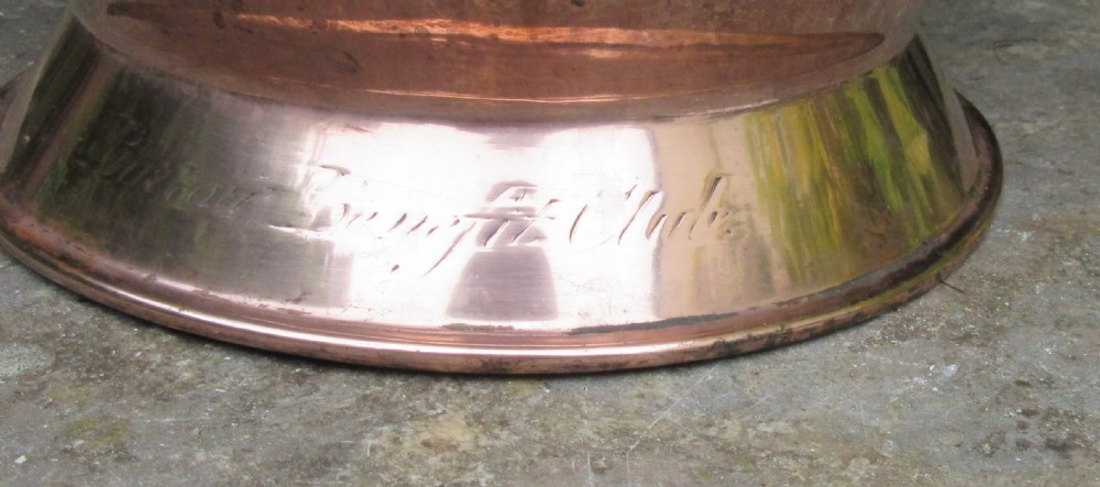 A polished Georgian copper tavern jug featuring a bulbous body, cylindrical neck, pouring spout, flared base, and a thick curved handle. View VII