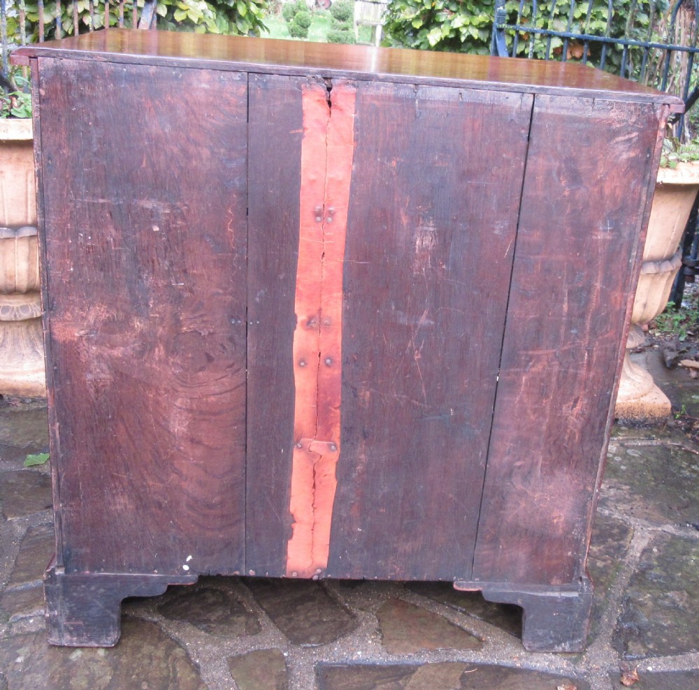 An 18th-century Georgian mahogany chest of drawers featuring four graduated drawers with brass handles, a brushing slide, and bracket feet. View VIII