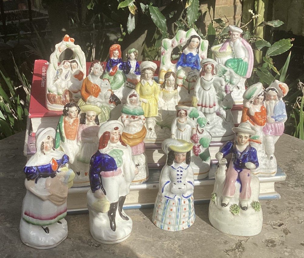 A collection of fifteen miniature hand-painted Victorian Staffordshire earthenware figurines depicting various folk characters.