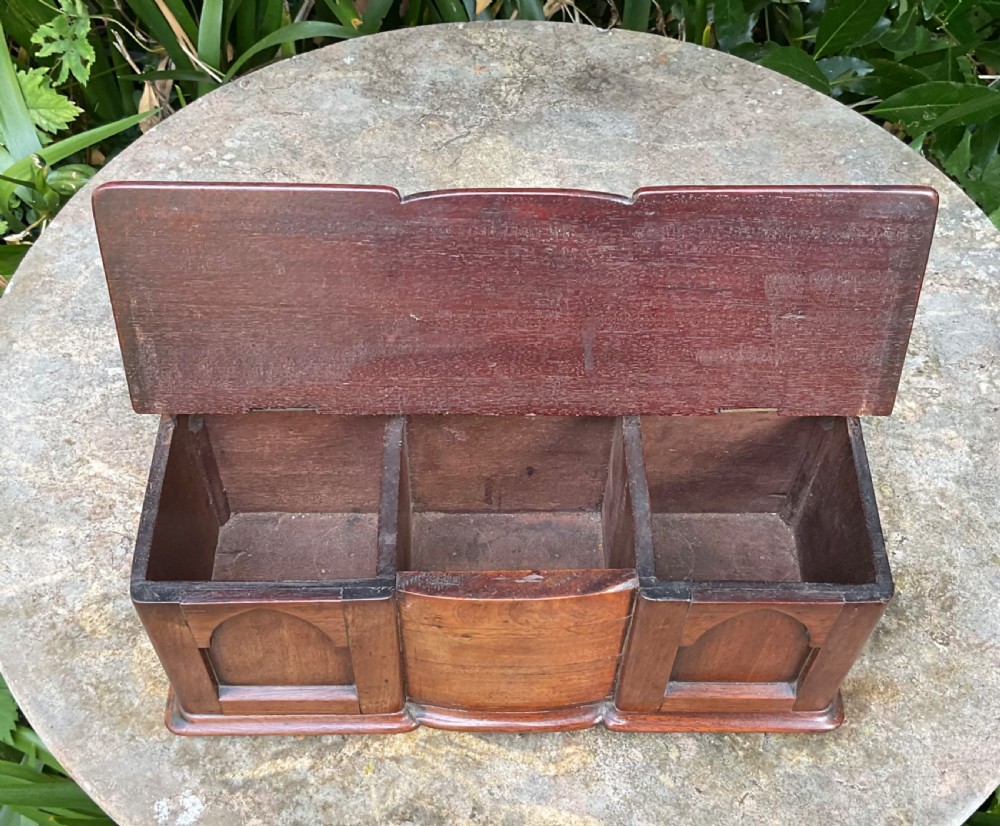 A Victorian mahogany miniature apprentice sideboard featuring a shaped gallery back, breakfront section, and arched panel doors. View VIII